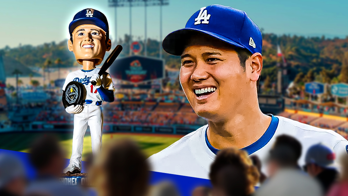 Shohei Ohtani next to a the Ohtani bobblehead in front of Dodgers stadium
