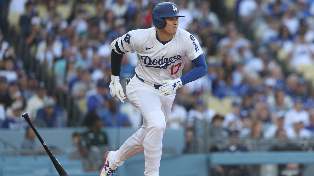 Los Angeles Dodgers designated hitter player Shohei Ohtani (17) runs to first base after hitting the ball into play during the fifth inning of the game at Dodger Stadium. Ohtani was out at first base on the play.