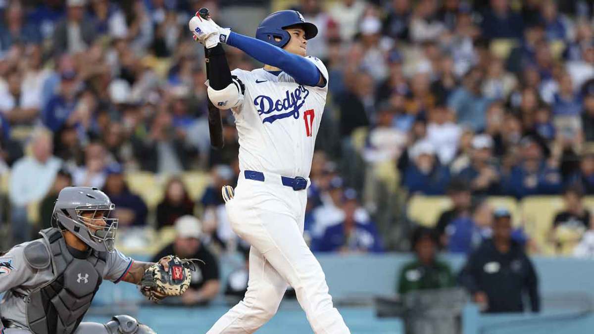 Los Angeles Dodgers two-way player Shohei Ohtani (17) hits a single in the first inning against the Miami Marlins during the first inning at Dodger Stadium.