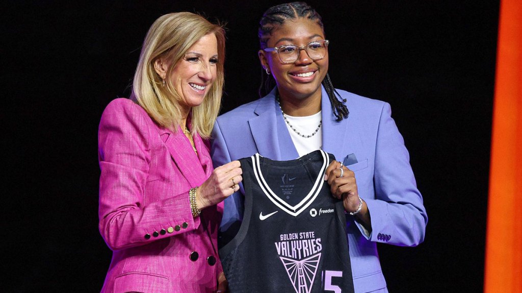Shyanne Sellers poses with WNBA commissioner Cathy Engelbert after being selected with the number seventeen overall pick to the Golden State Valkyries in the 2025 WNBA Draft.