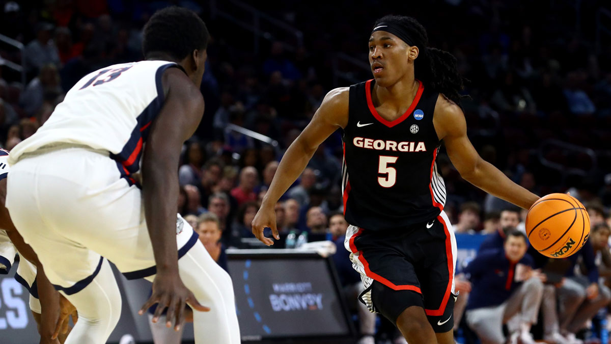 Georgia Bulldogs guard Silas Demary Jr. (5) dribbles against Gonzaga Bulldogs forward Graham Ike (13) in the second half of a first round men’s NCAA Tournament game at Intrust Bank Arena.