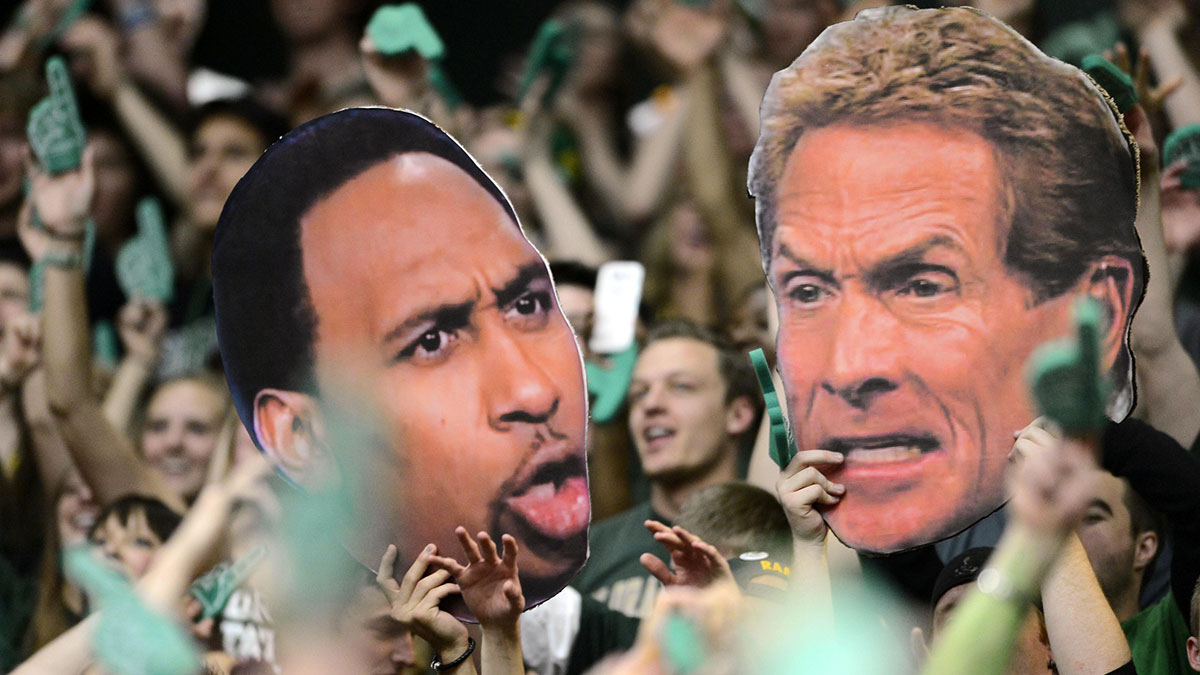 Colorado State Rams fans hold large cut outs of ESPN television personality Stephen A. Smith (left) and Skip Bayless (right) during the game against the New Mexico Lobos at Moby Arena. The Lobos defeated the Rams 91-82.