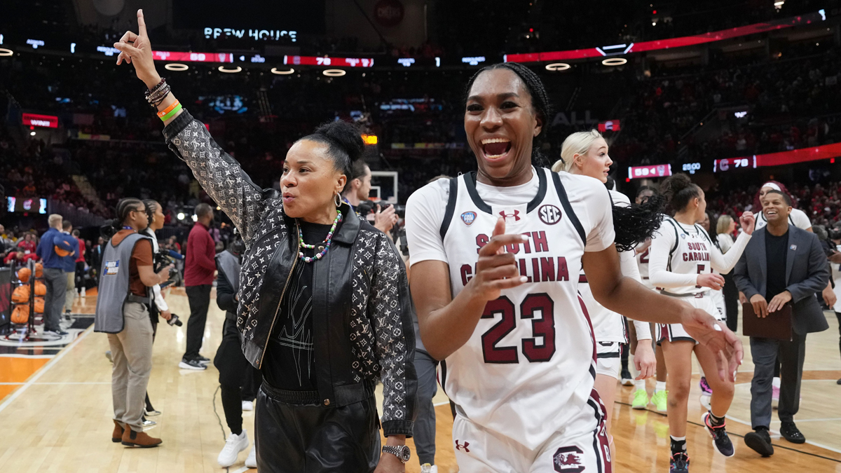 South Carolina womens basketball head coach Dawn Staley and guard Bree Hall (23) celebrate after defeating the NC State Wolfpack in the semifinals of the Final Four of the womens 2024 NCAA Tournament at Rocket Mortgage FieldHouse.