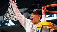 South Carolina women's basketball head coach Dawn Staley cuts down the net as the Gamecocks celebrate their NCAA Regional Final game win over Duke at Legacy Arena in Birmingham Alabama.