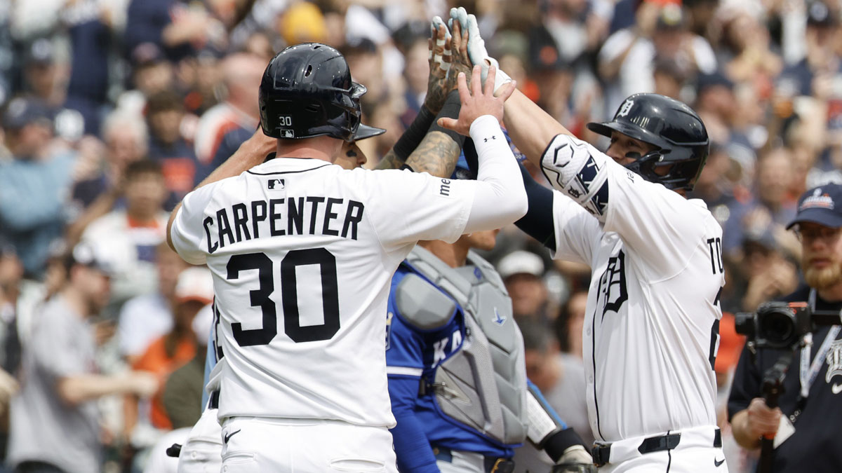 Detroit Tigers first base Spencer Torkelson (20) receives congratulations from shortstop Javier Báez (28) and outfielder Kerry Carpenter (30) after he hits a t three run home run in the fifth inning against the Kansas City Royals at Comerica Park.