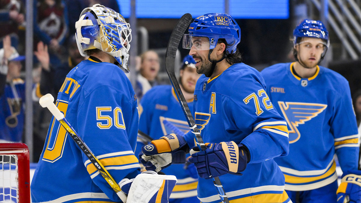 St. Louis Blues goaltender Jordan Binnington (50) and defenseman Justin Faulk (72) celebrate after the Blues won their franchise record 12th straight win after a victory over the Colorado Avalanche at Enterprise Center.
