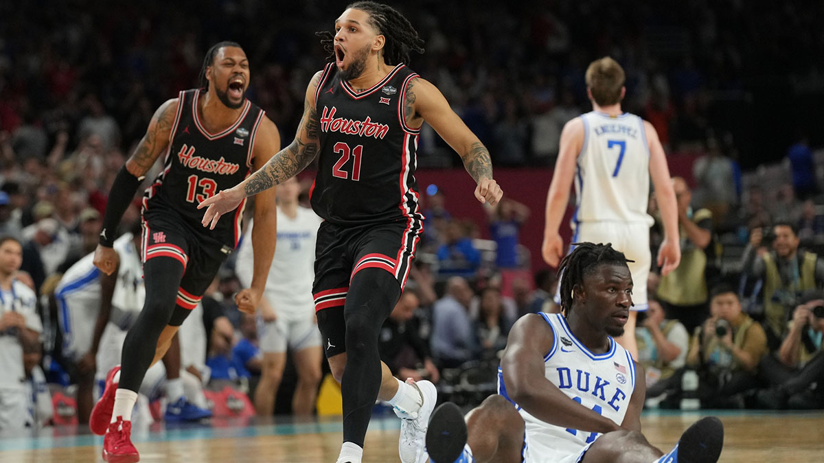 Houston Cougars guard Emanuel Sharp (21) and Houston Cougars forward J'Wan Roberts (13) celebrate defeating the Duke Blue Devils in the semifinals of the men's Final Four of the 2025 NCAA Tournament at the Alamodome.