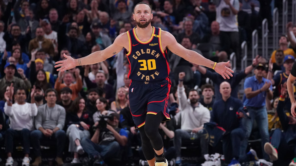 Golden State Warriors guard Stephen Curry (30) celebrates after scoring against the Denver Nuggets in the second period at Chase Center.