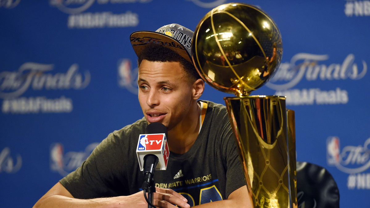 Golden State Warriors guard Stephen Curry (30) talks to the media after beating the Cleveland Cavaliers in game six of the NBA Finals at Quicken Loans Arena.