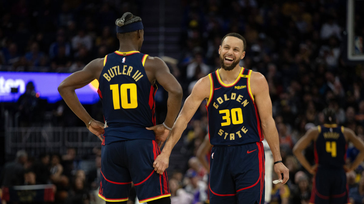 Golden State Warriors forward Jimmy Butler III (10) and guard Stephen Curry (30) share a laugh during the second quarter against the Sacramento Kings at Chase Center.