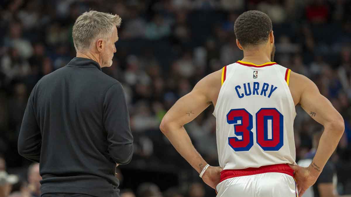 Golden State Warriors head coach Steve Kerr and guard Stephen Curry (30) look on against the Minnesota Timberwolves in the second half at Target Center.