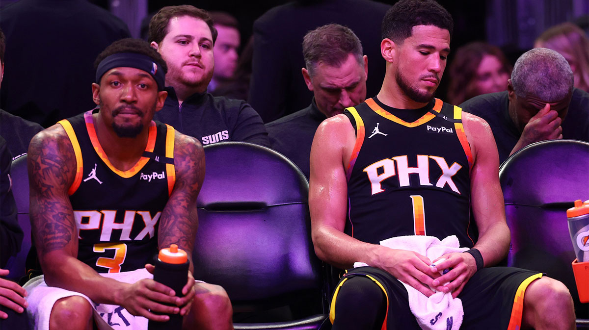 Suns All-Star Devin Booker next to Suns guard Bradley Beal with Thunder All-Star Jalen Williams in the background and the Lakers logo
