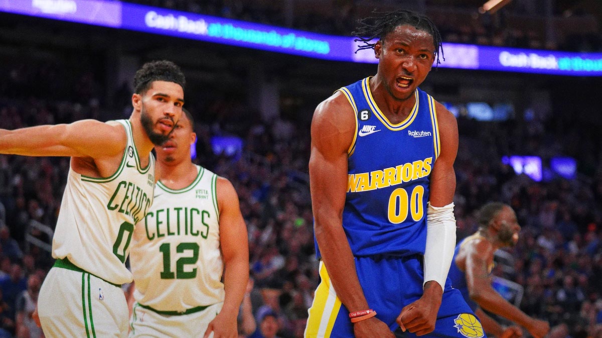 Golden State Warriors forward Jonathan Kuminga (00) reacts after making a basket against Boston Celtics forward Jayson Tatum (0) in the fourth quarter at the Chase Center.