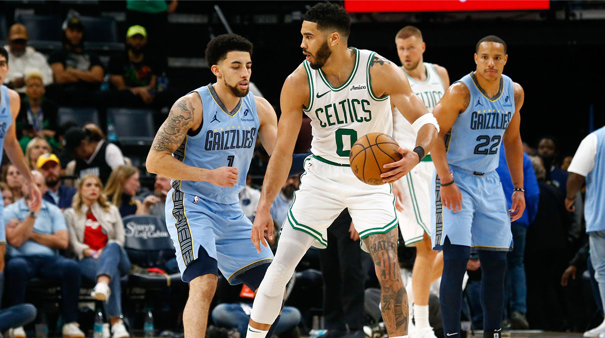 Boston Celtics forward Jayson Tatum (0) dribbles as Memphis Grizzlies guard Scotty Pippen Jr. (1) defends during the fourth quarter at FedExForum.