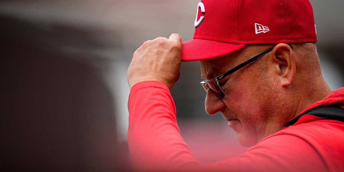 Cincinnati Reds manager Terry Francona (77) adjusts his hat as the Mariners take the lead in the 10th inning of the MLB Interleague game between the Cincinnati Reds and the Seattle Mariners at Great American Ball Park in downtown Cincinnati on Thursday, April 17, 2025. The Mariners beat the Reds, 11-7, in 10 innings.