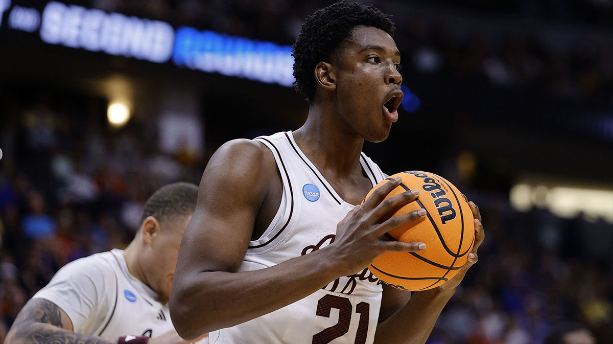Texas A&M Aggies basketball forward Pharrel Payne (21) reacts against the Michigan Wolverines during the first half in the second round of the NCAA Tournament at Ball Arena.
