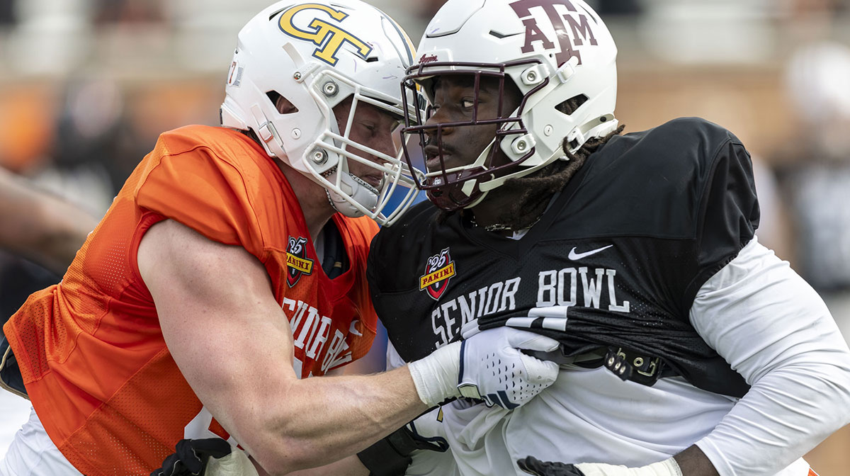 American team tight end Jackson Hawes of Georgia Tech (87) spars with American team defensive lineman Shemar Stewart of Texas A&M (14) during Senior Bowl practice for the American team at Hancock Whitney Stadium.