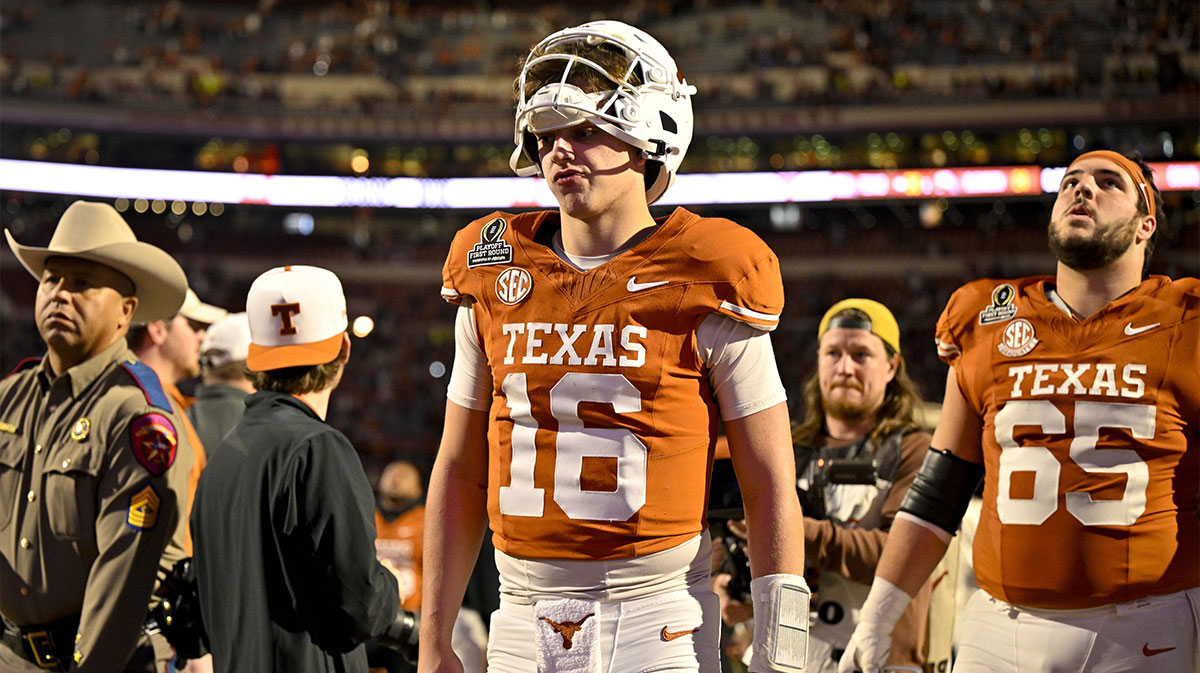 Texas Longhorns quarterback Arch Manning (16) walks off the field after UT defeats the Clemson Tigers in the CFP National Playoff first round game at Darrell K Royal-Texas Memorial Stadium.