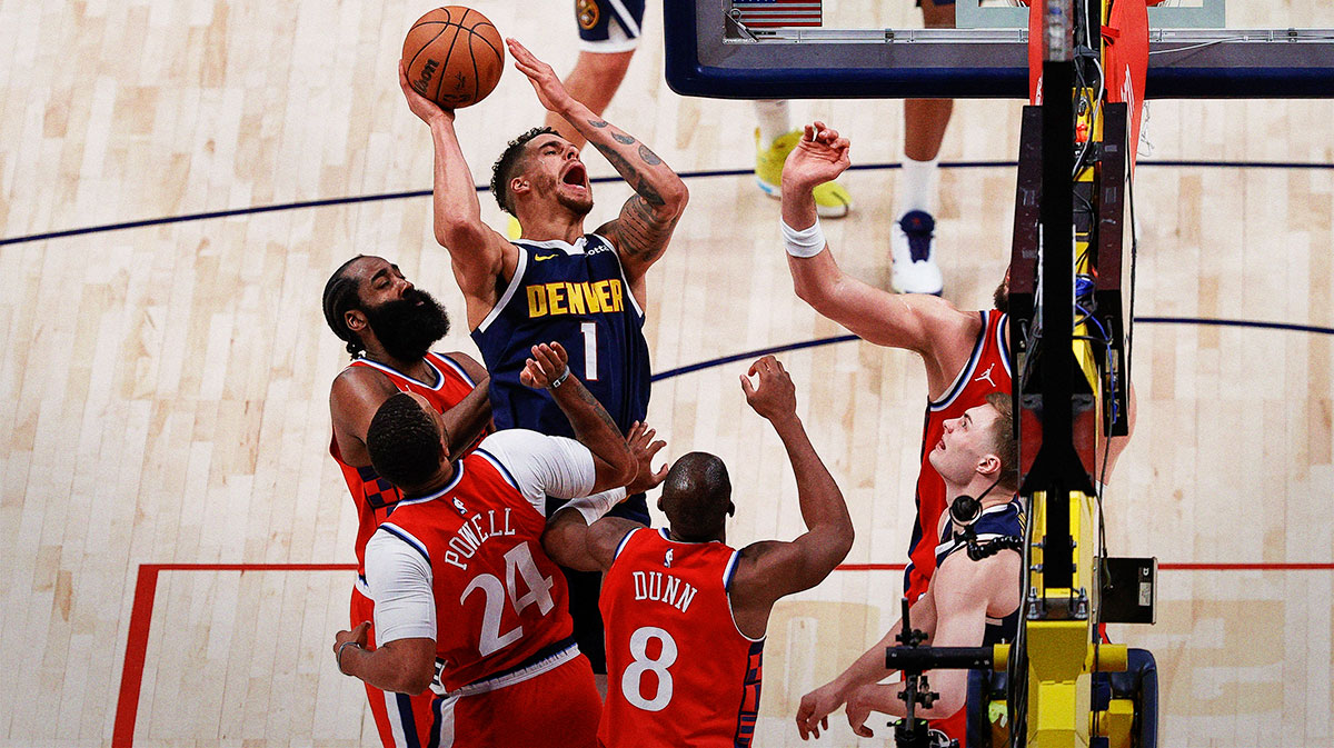 Denver Nuggets forward Michael Porter Jr. (1) is fouled as he attempts a shot against Los Angeles Clippers guard James Harden (1) and guard Norman Powell (24) and guard Kris Dunn (8) in the fourth quarter during game two of first round for the 2025 NBA Playoffs at Ball Arena.