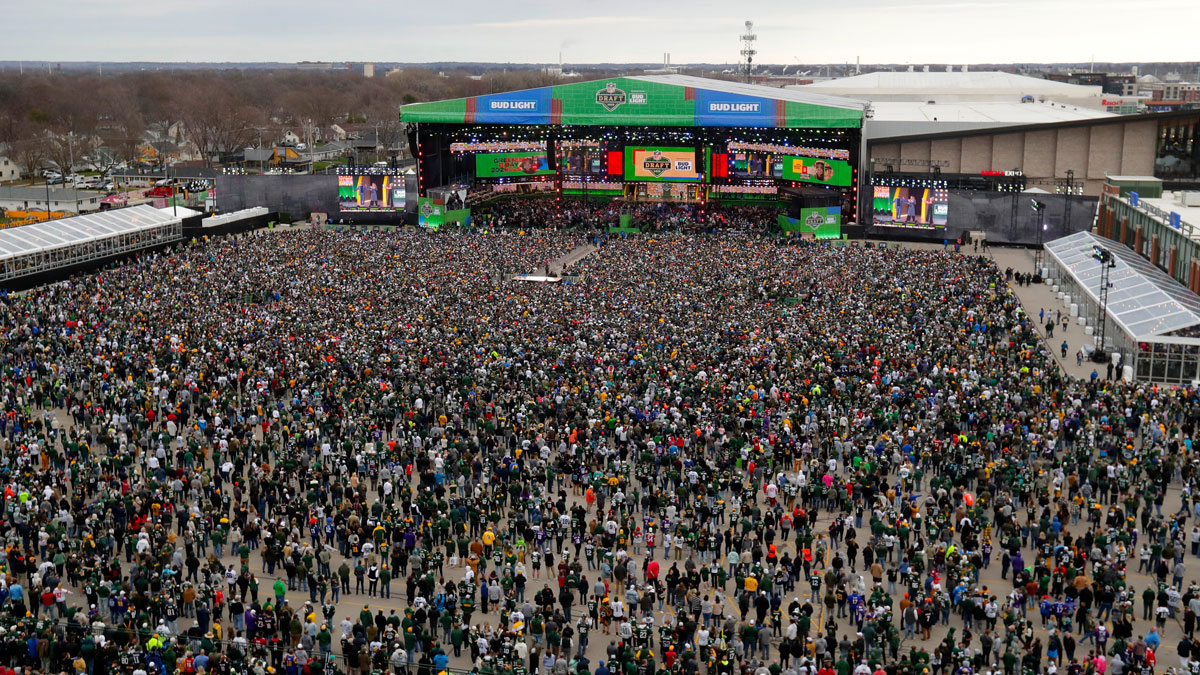 Thousands of people fill the draft theater viewing area at the start of the 2025 NFL Draft on April 24, 2025, outside Lambeau Field in Green Bay, Wis.