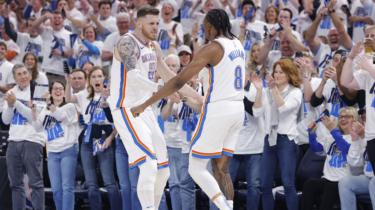 Thunder center Isaiah Hartenstein (55) and forward Jalen Williams (8) celebrate against the Memphis Grizzlies during the second quarter at Paycom Center