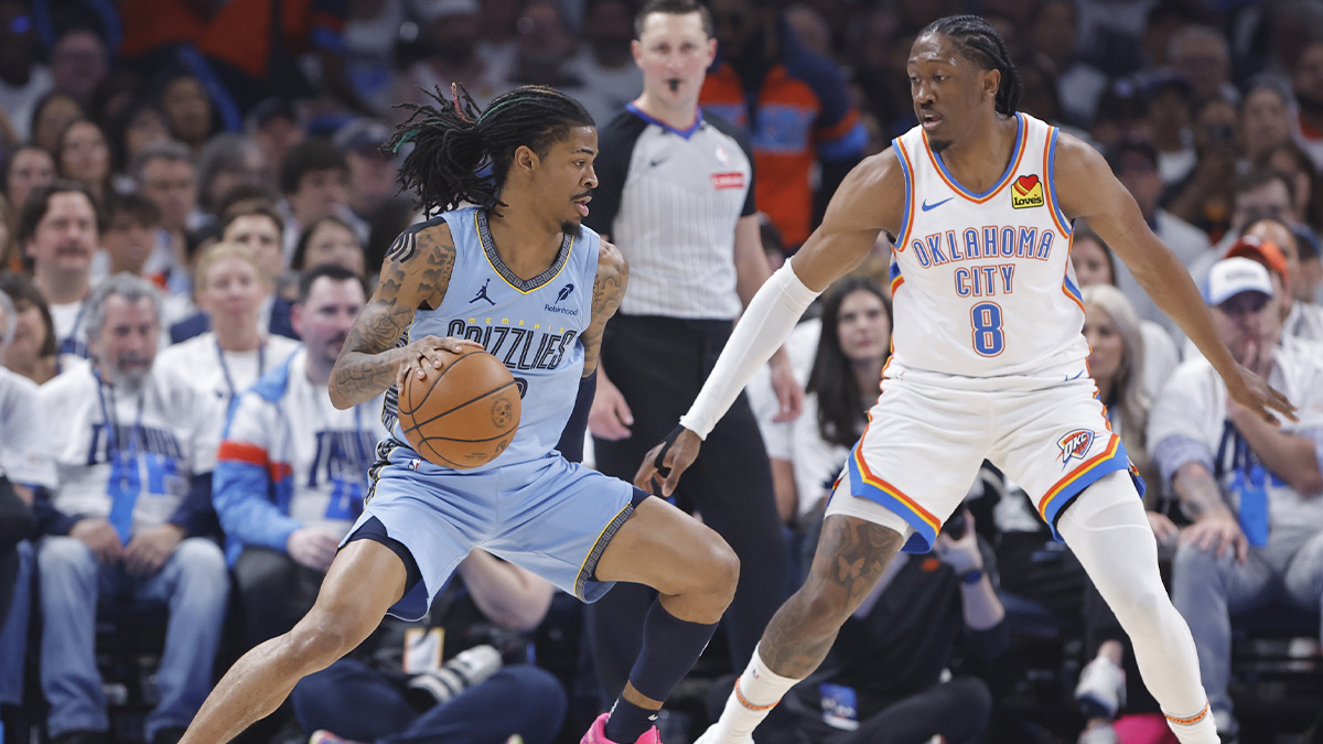 Grizzlies guard Ja Morant (12) drives to the basket as Oklahoma City Thunder forward Jalen Williams (8) defends during the first quarter at Paycom Center