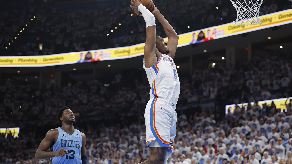 Thunder forward Jalen Williams (8) dunks as Memphis Grizzlies forward Jaren Jackson Jr. (13) watches from behind during the second quarter at Paycom Center