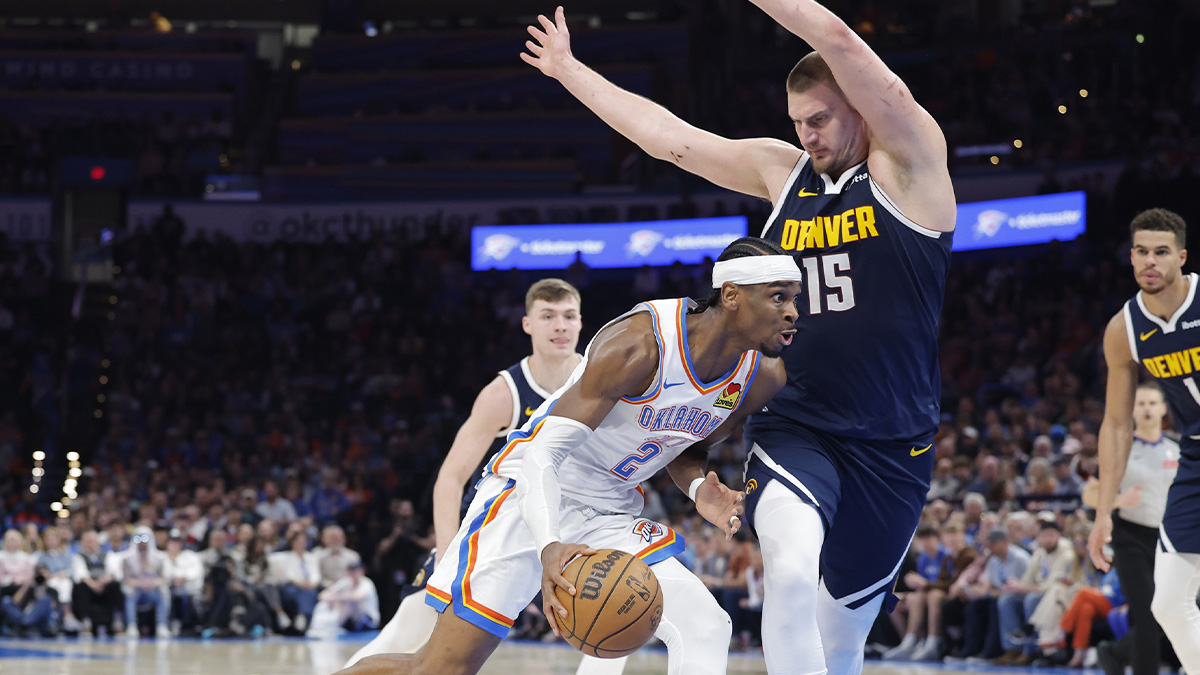 Thunder guard Shai Gilgeous-Alexander (2) drives against Denver Nuggets center Nikola Jokic (15) during the second half at Paycom Center