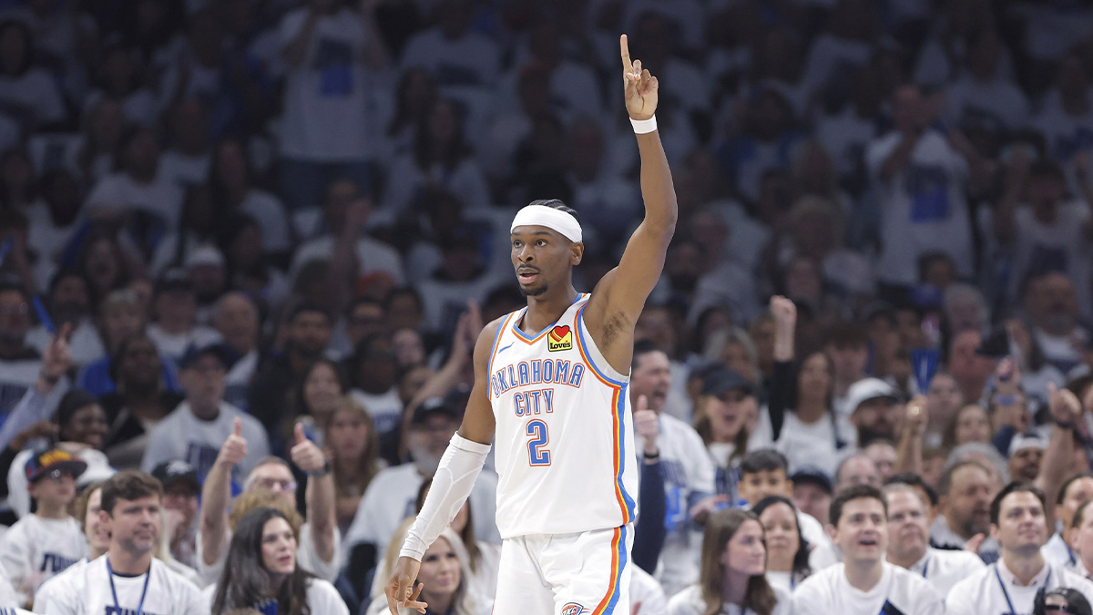 Shai Gilgeous-Alexander gives Thunder GM Sam Presti his flowers after Game 1 win