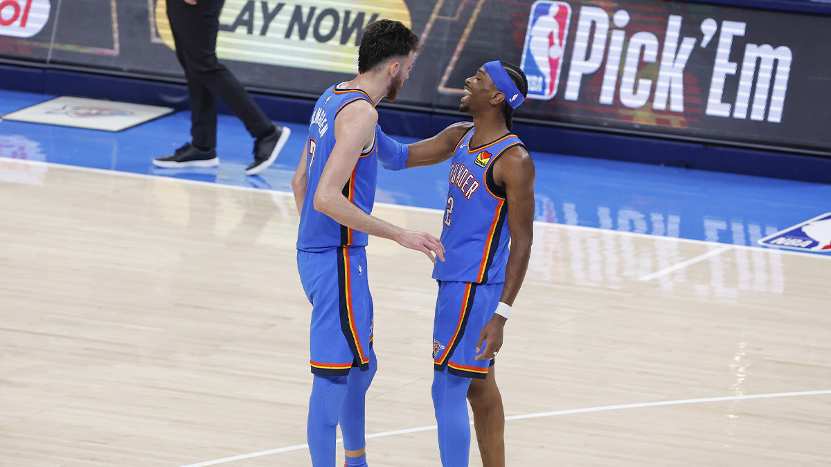 Thunder guard Shai Gilgeous-Alexander (2) and forward Chet Holmgren (7) laugh in the fourth quarter during game two of first round for the 2024 NBA Playoffs against the Memphis Grizzlies at Paycom Center
