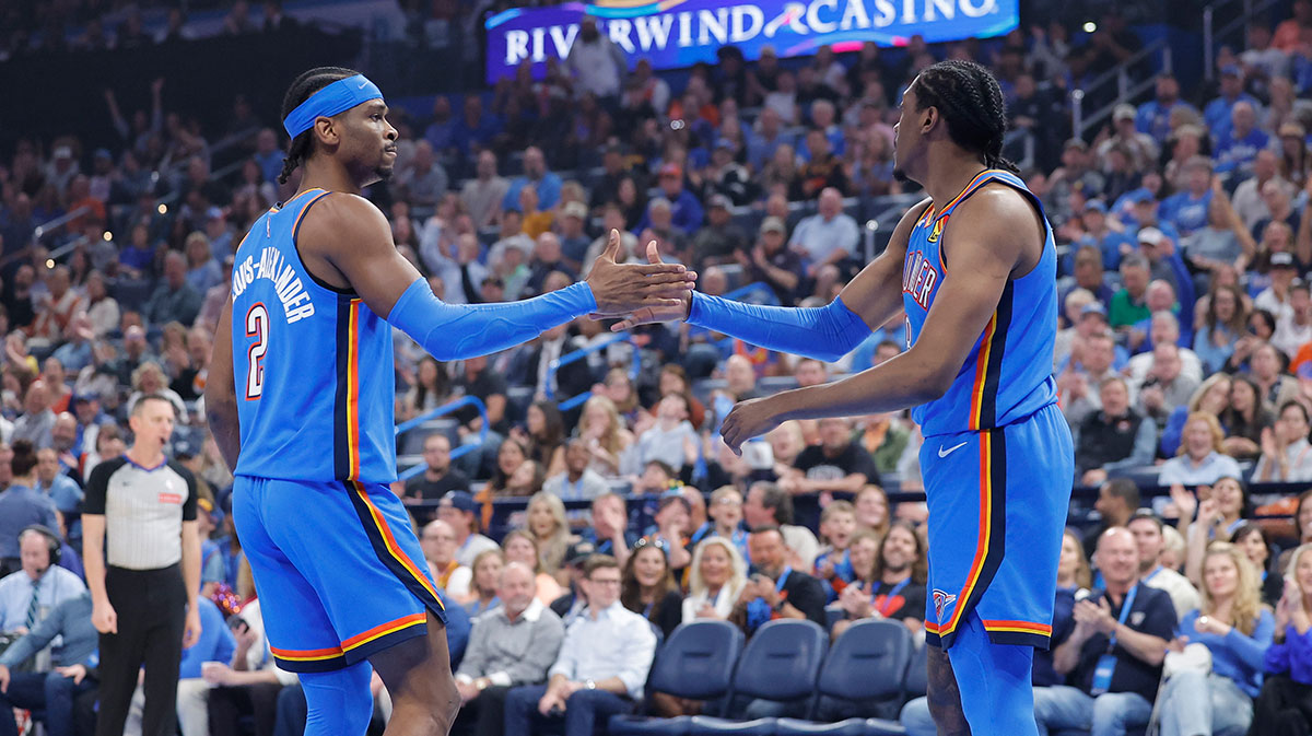Oklahoma City Thunder guard Shai Gilgeous-Alexander (2) and forward Jalen Williams (8) high five after a play against the Detroit Pistons during the first quarter at Paycom Center.
