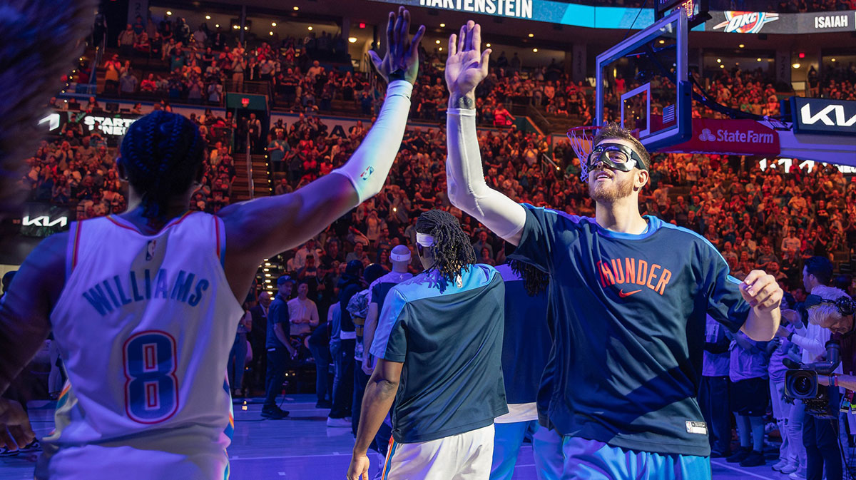 Thunder center Isaiah Hartenstein (55) high fives Oklahoma City Thunder forward Jalen Williams (8) during introductions before the start of a game against the Memphis Grizzlies at Paycom Center