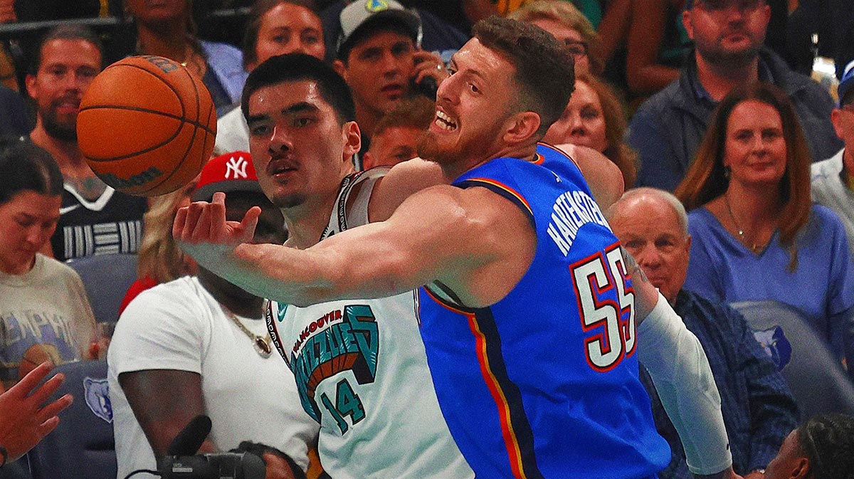 Grizzlies center Zach Edey (14) and Oklahoma City Thunder center Isaiah Hartenstein (55) reach for a rebound during the first quarter during game three for the first round of the 2024 NBA Playoffs at FedExForum next to Thunder head coach Mark Daigneault