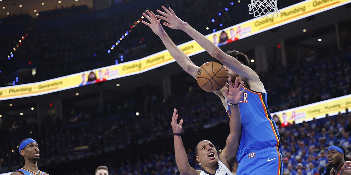 Thunder guard Shai Gilgeous-Alexander (2) and forward Chet Holmgren (7) laugh in the fourth quarter during game two of first round for the 2024 NBA Playoffs against the Memphis Grizzlies at Paycom Center