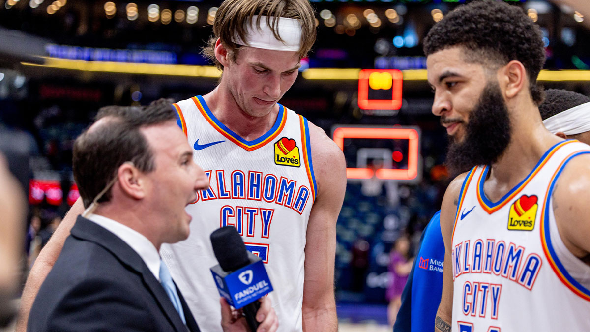 Thunder forward Kenrich Williams (34) and center Branden Carlson (15) talk to reporter Nick Gallo after the game against the New Orleans Pelicans at Smoothie King Center