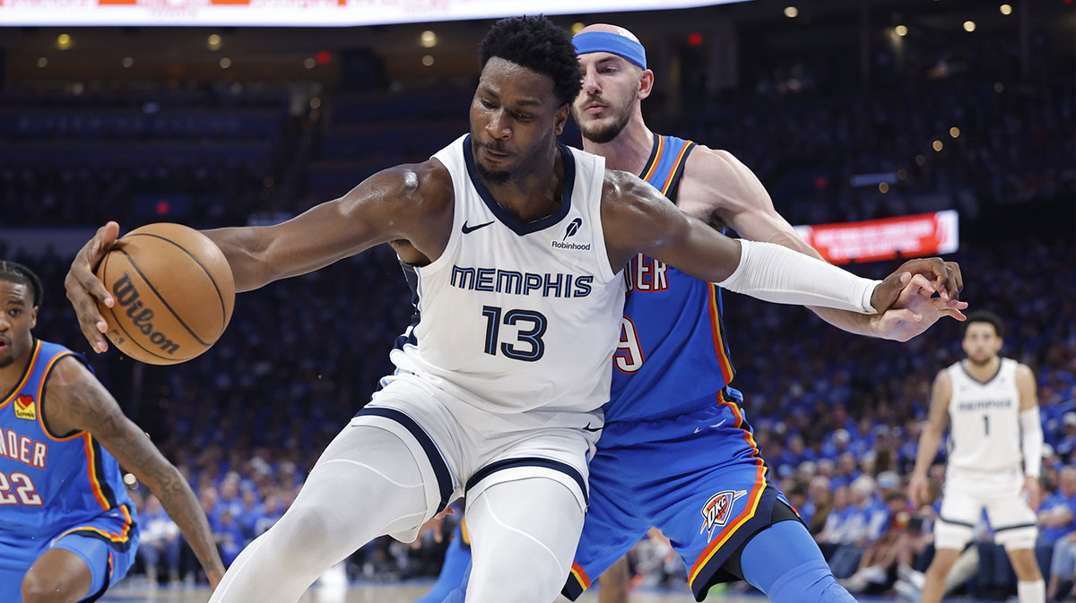 Grizzlies forward Jaren Jackson Jr. (13) moves the ball against Oklahoma City Thunder guard Alex Caruso (9) in the third quarter during game two of first round for the 2024 NBA Playoffs at Paycom Center