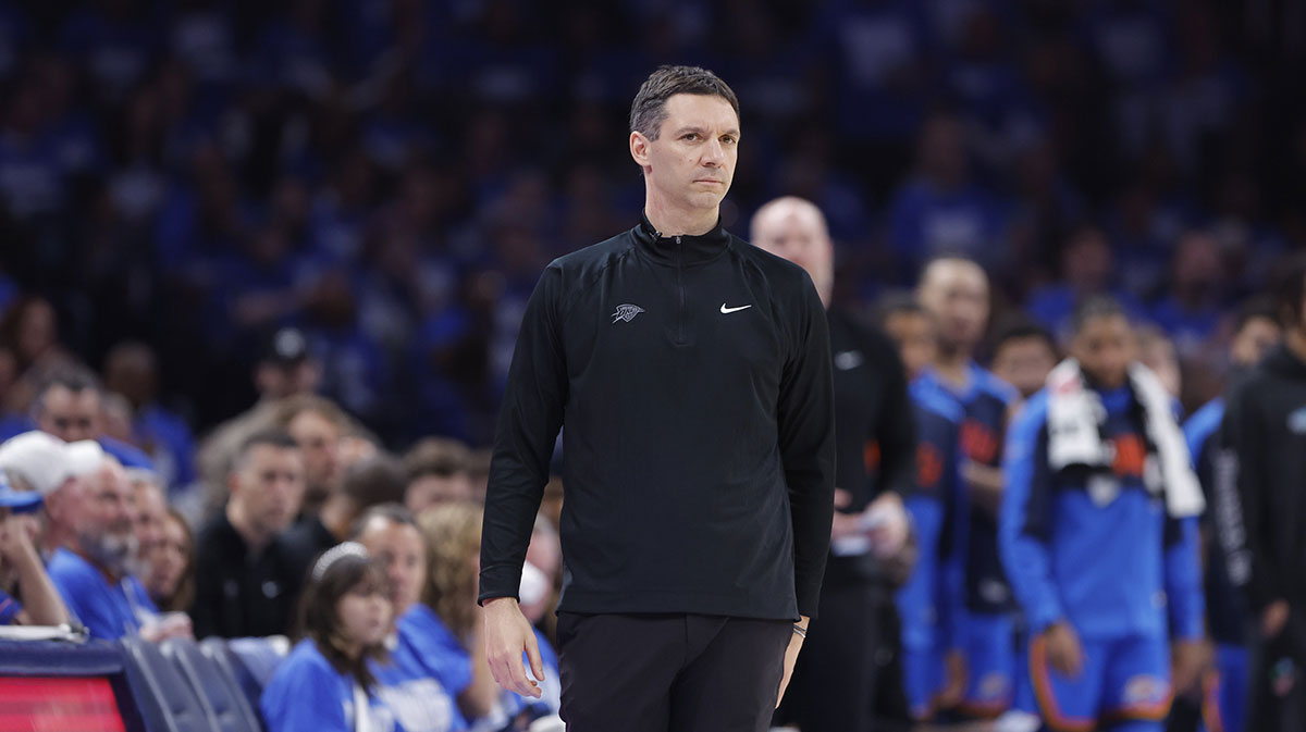 Thunder head coach Mark Daigneault watches his team play against the Memphis Grizzlies in the third quarter during game two of first round for the 2024 NBA Playoffs at Paycom Center next to Thunder's Alex Caruso