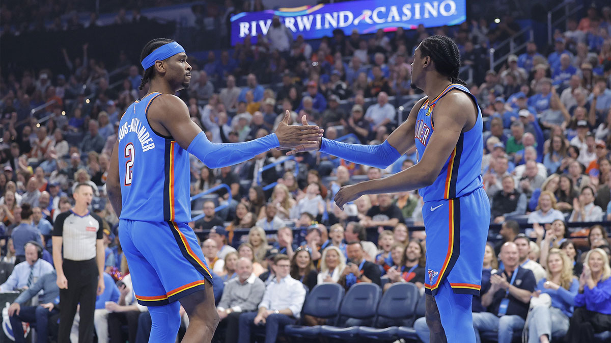 Oklahoma City Thunder guard Shai Gilgeous-Alexander (2) and forward Jalen Williams (8) high five after a play against the Detroit Pistons during the first quarter at Paycom Center.