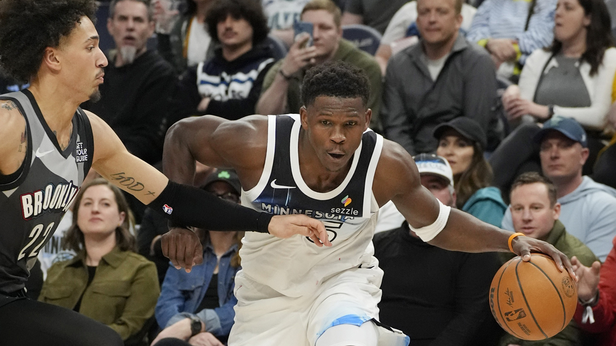 Minnesota Timberwolves guard Anthony Edwards (5) works around Brooklyn Nets forward Jalen Wilson (22) in the third quarter at Target Center.
