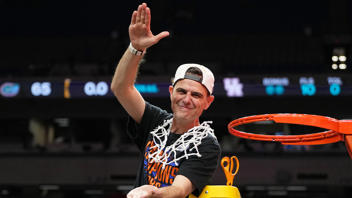 Florida Gators head coach Todd Golden reacts after cutting down a piece of the net after winning the national championship game of the Final Four of the 2025 NCAA Tournament at the Alamodome.