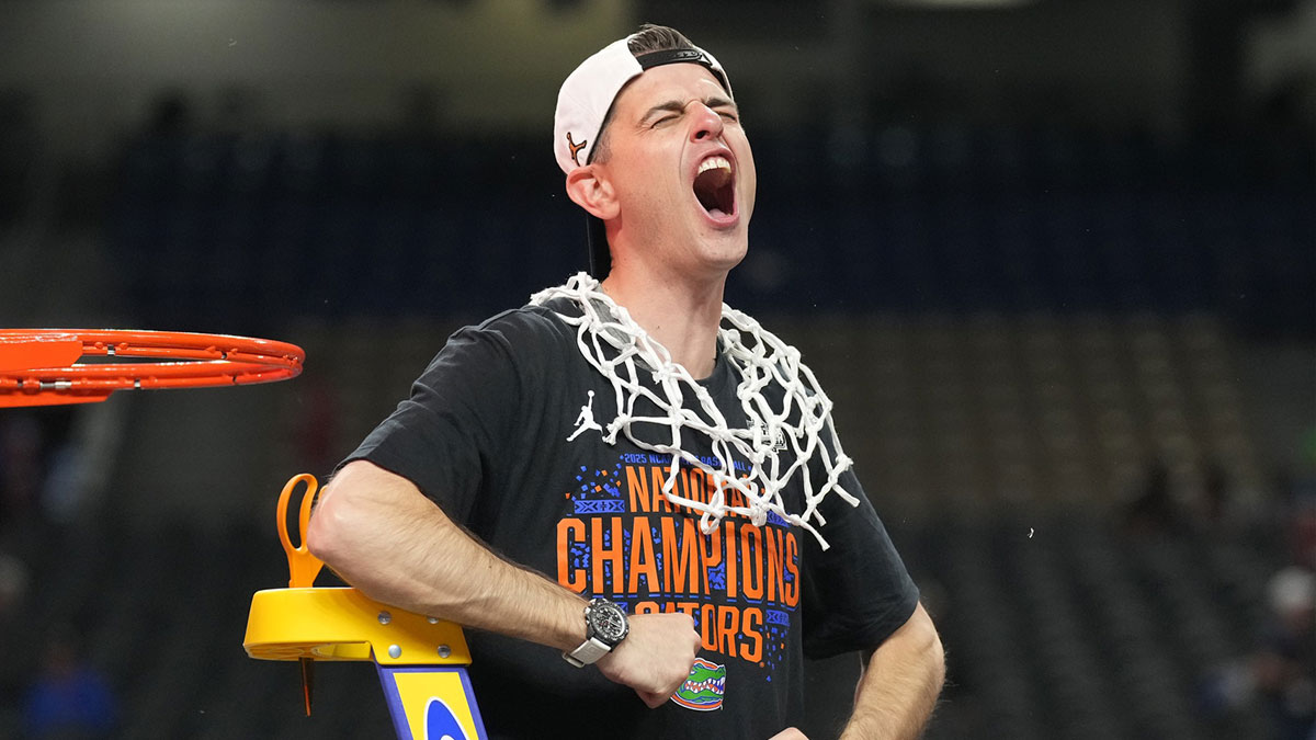 Florida Gators head coach Todd Golden celebrates as he cuts down the net after defeating the Houston Cougars in the national championship game of the Final Four of the 2025 NCAA Tournament at the Alamodome.
