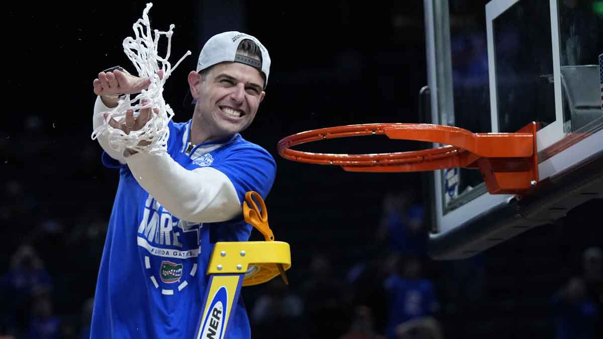 Florida Gators head coach Todd Golden celebrates after cutting the net down following the Florida Gators win over the Texas Tech Red Raiders during the West Regional final of the 2025 NCAA tournament at Chase Center.