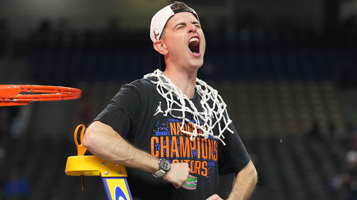 Florida Gators head coach Todd Golden celebrates as he cuts down the net after defeating the Houston Cougars in the national championship game of the Final Four of the 2025 NCAA Tournament at the Alamodome.