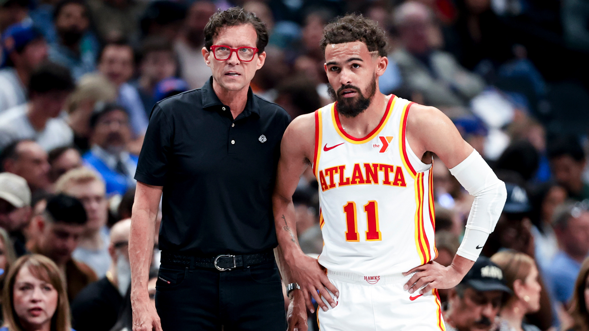 Atlanta Hawks head coach Quin Snyder speaks with Atlanta Hawks guard Trae Young (11) during the first half against the Dallas Mavericks at American Airlines Center.