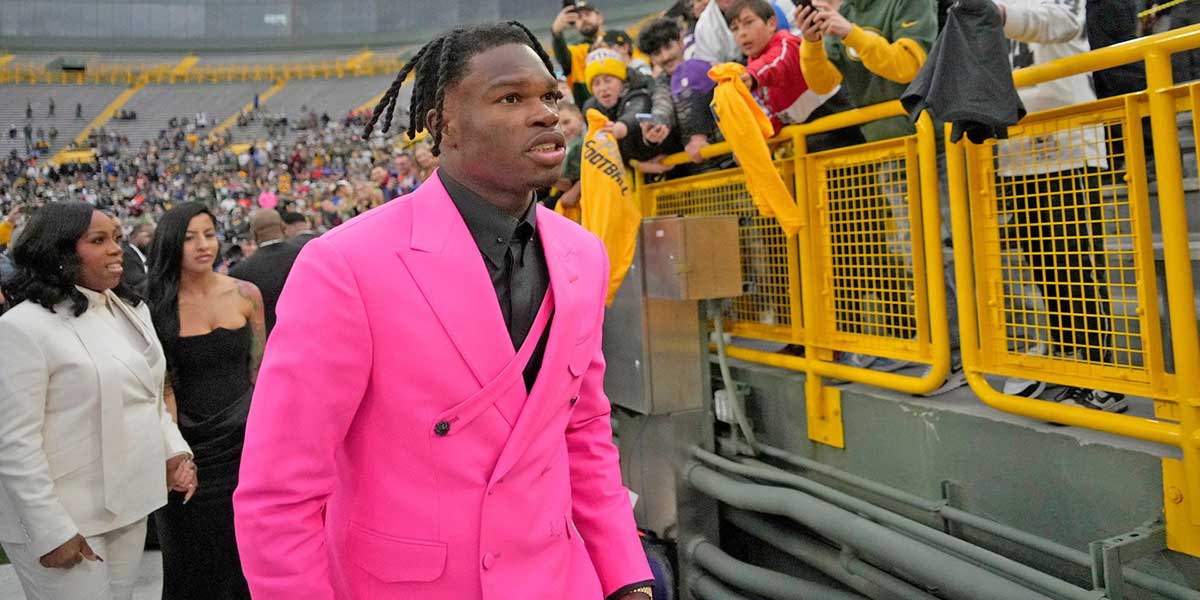 Colorado Buffaloes wide receiver Travis Hunter, signs autographs during the NFL Draft Red Carpet event at Lambeau Field in Green Bay on Thursday, April 24, 2025.