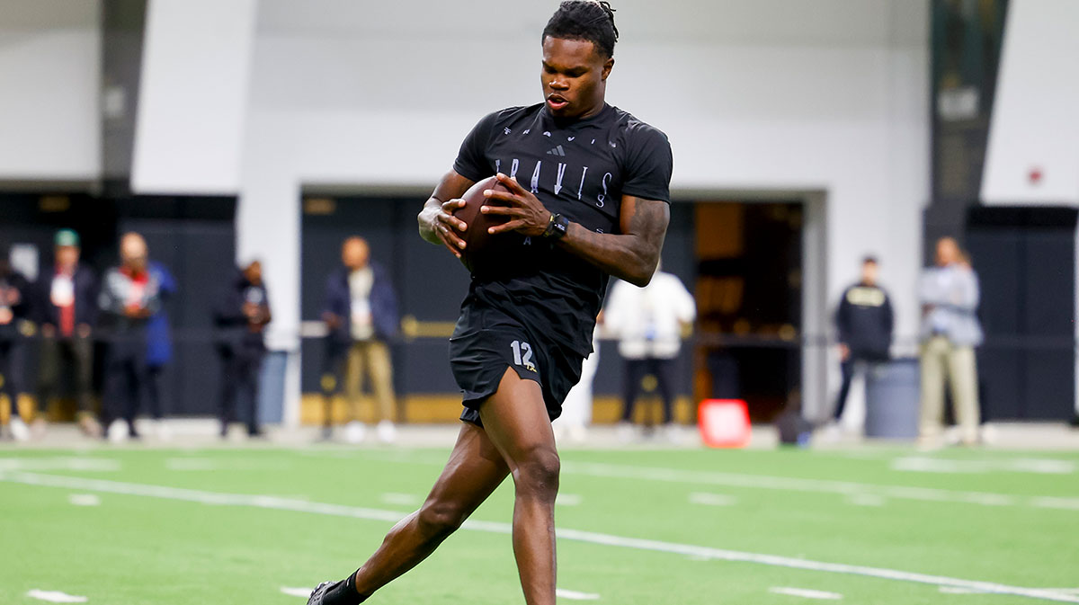Colorado football player Travis Hunter (12) catches a pass at the University of Colorado NFL Showcase at the CU Indoor Practice Facility.