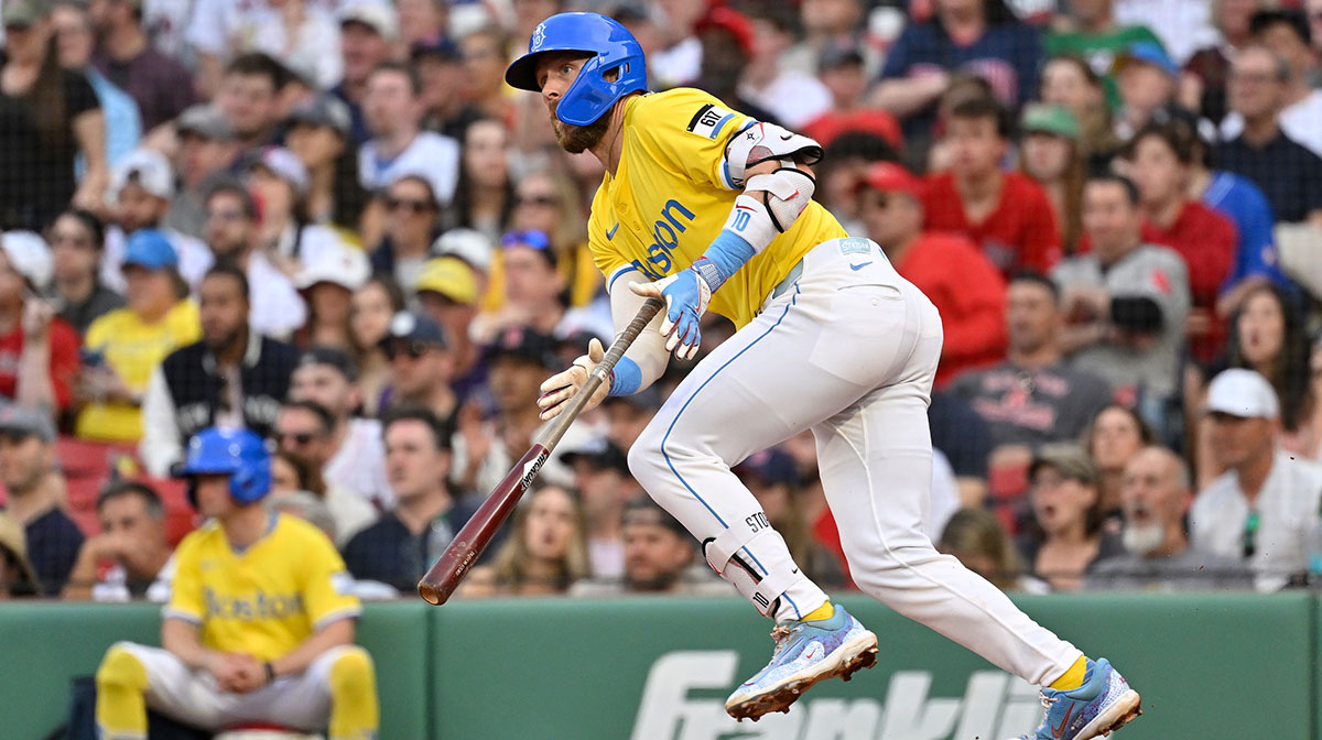 Boston Red Sox shortstop Trevor Story (10) hits a single against the Chicago White Sox during the eighth inning at Fenway Park.
