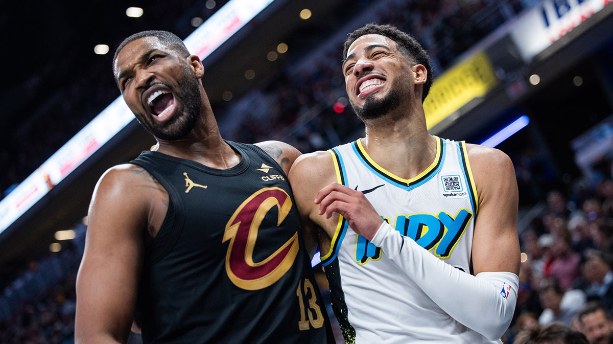 Cleveland Cavaliers center Tristan Thompson (13) and Indiana Pacers guard Tyrese Haliburton (0) hug it out after a foul in the second half at Gainbridge Fieldhouse.