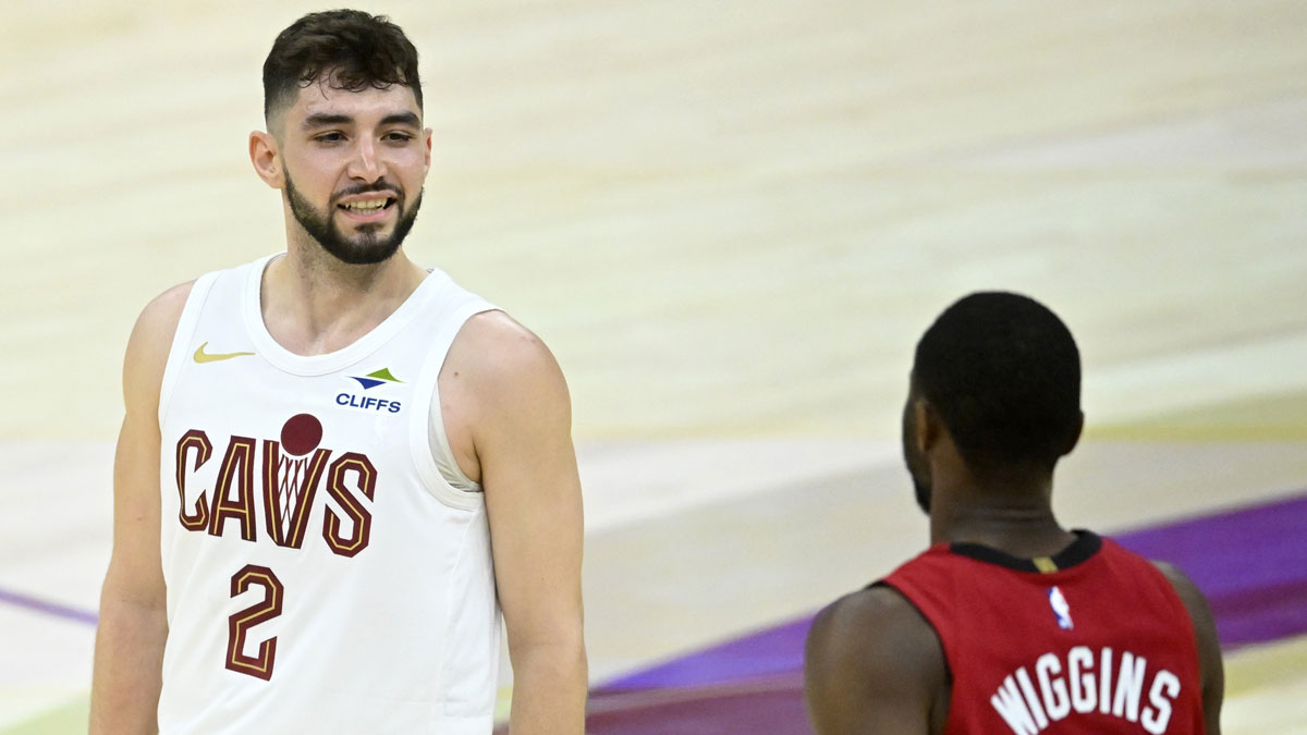 Cleveland Cavaliers guard Ty Jerome (2) reacts beside Miami Heat forward Andrew Wiggins (22) after making a three-point basket in the fourth quarter at Rocket Arena. 