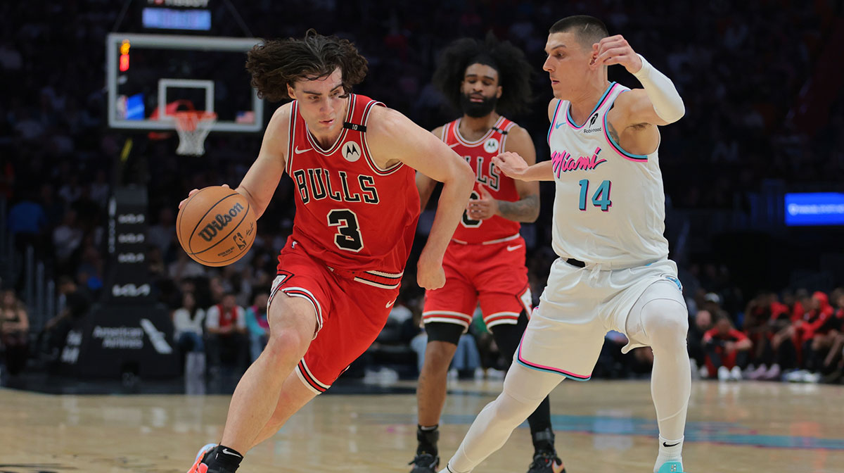Chicago Bulls guard Josh Giddey (3) drives to the basket against Miami Heat guard Tyler Herro (14) during the second quarter at Kaseya Center.